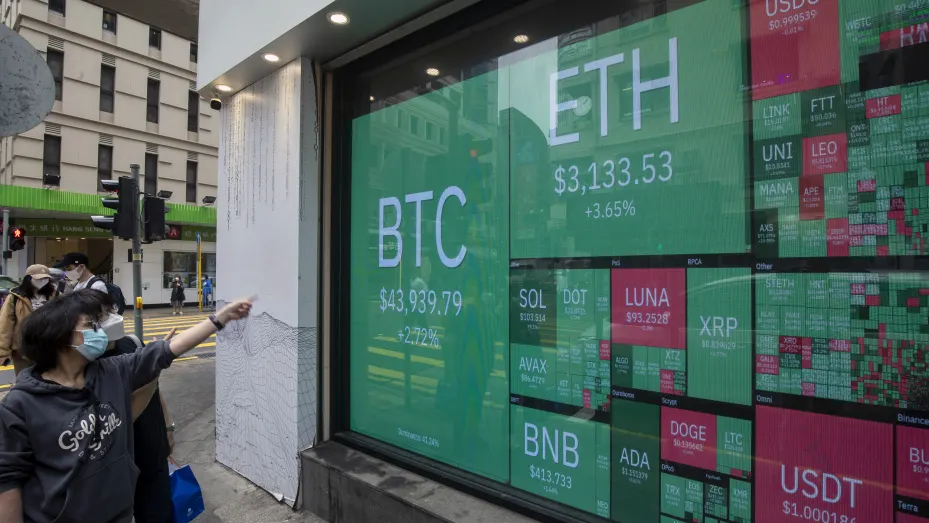 A digital screen displays the prices of cryptocurrencies to U.S. dollar in Hong Kong, China, on Friday, March 25, 2022.