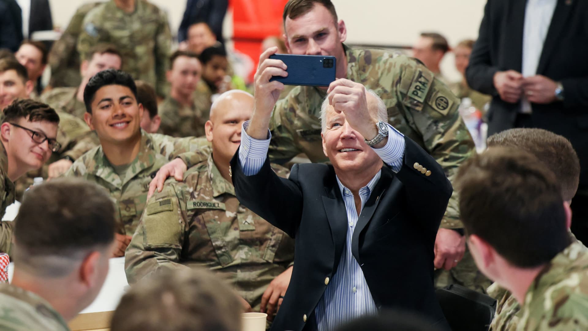 U.S. President Joe Biden takes a selfie with U.S. Army soldiers assigned to the 82nd Airborne Division at the G2 Arena in Jasionka, near Rzeszow, Poland, March 25, 2022. 