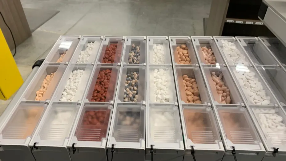 Canisters of pills go into robot-powered pods at Walgreens' automated facility in the Dallas area.