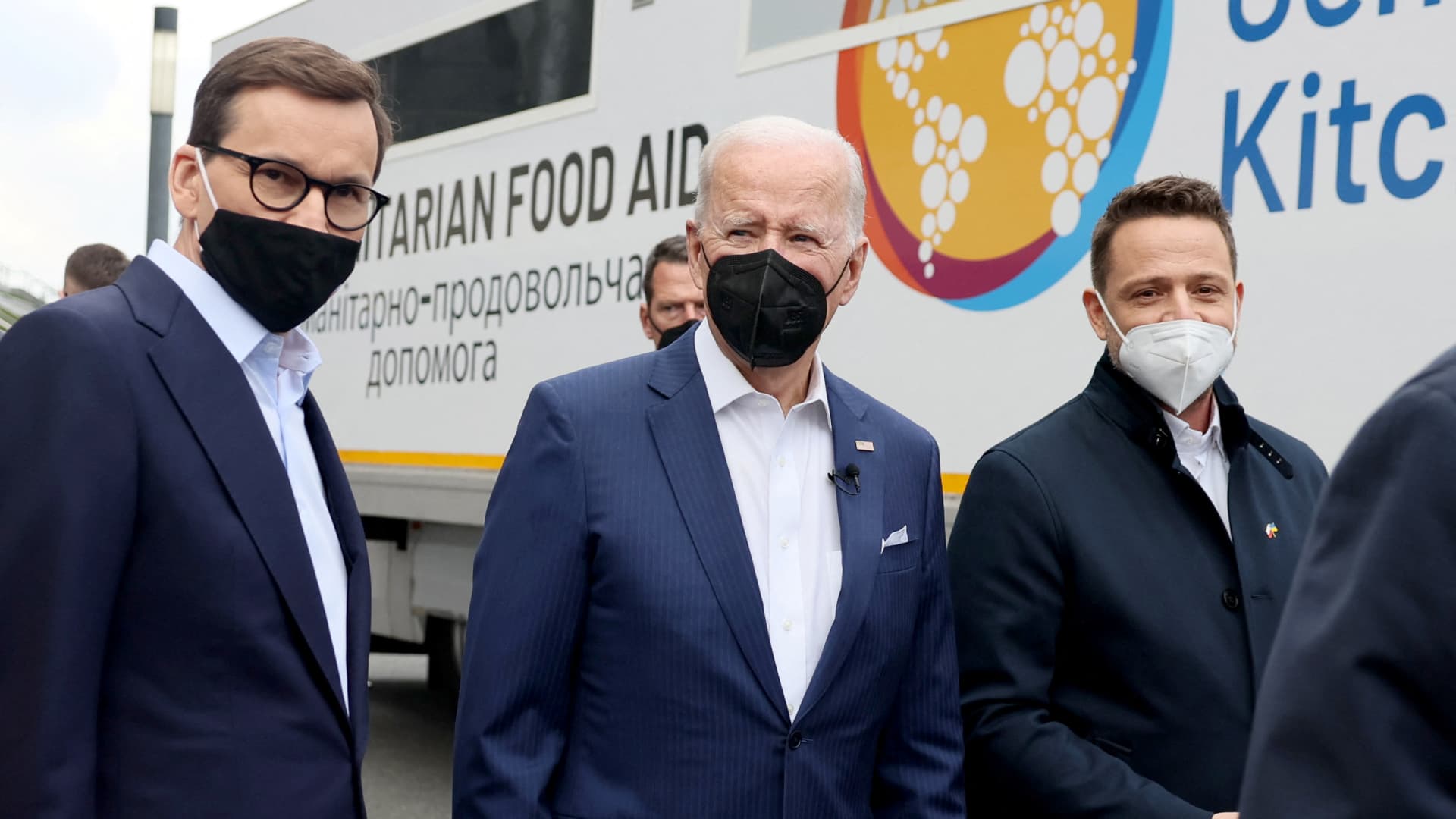 President Joe Biden, flanked by Mayor of Warsaw Rafal Trzaskowski and Polish Prime Minister Mateusz Morawiecki, visits Ukrainian refugees at PGE National Stadium, in Warsaw, Poland March 26, 2022.