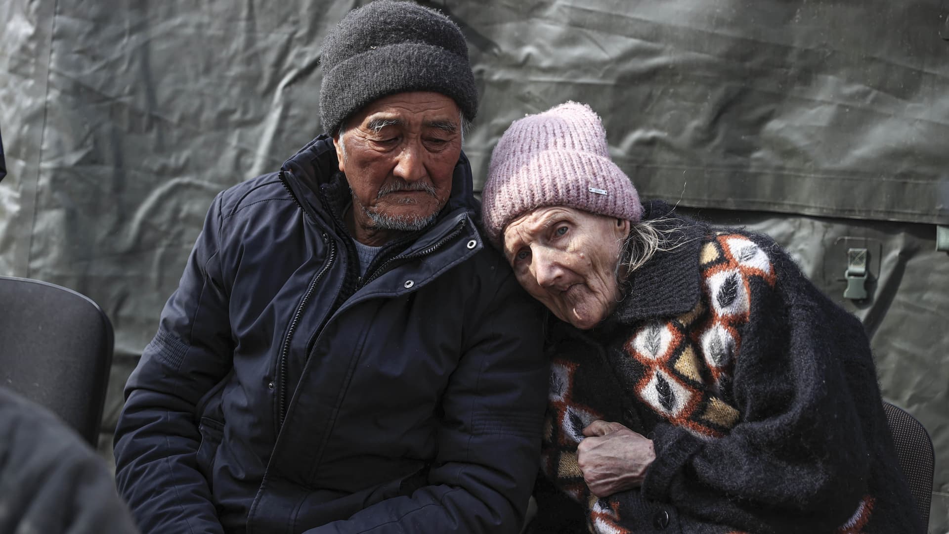 69 years old Boris Khijniak and his 75 year old wife Galina are brought to a center near Ukrainian capital Kyiv's Irpin as evacuation of civilians from Ukraine's Irpin continue, on March 26, 2022.