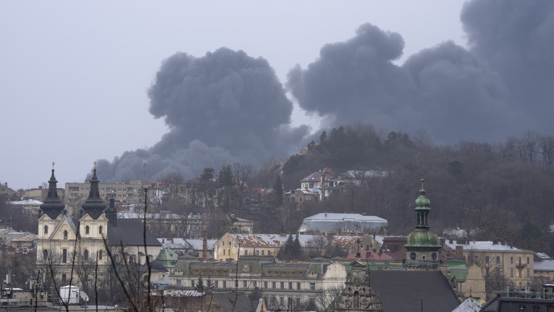 Smoke rises in the air in Lviv, western Ukraine, Saturday, March 26, 2022.