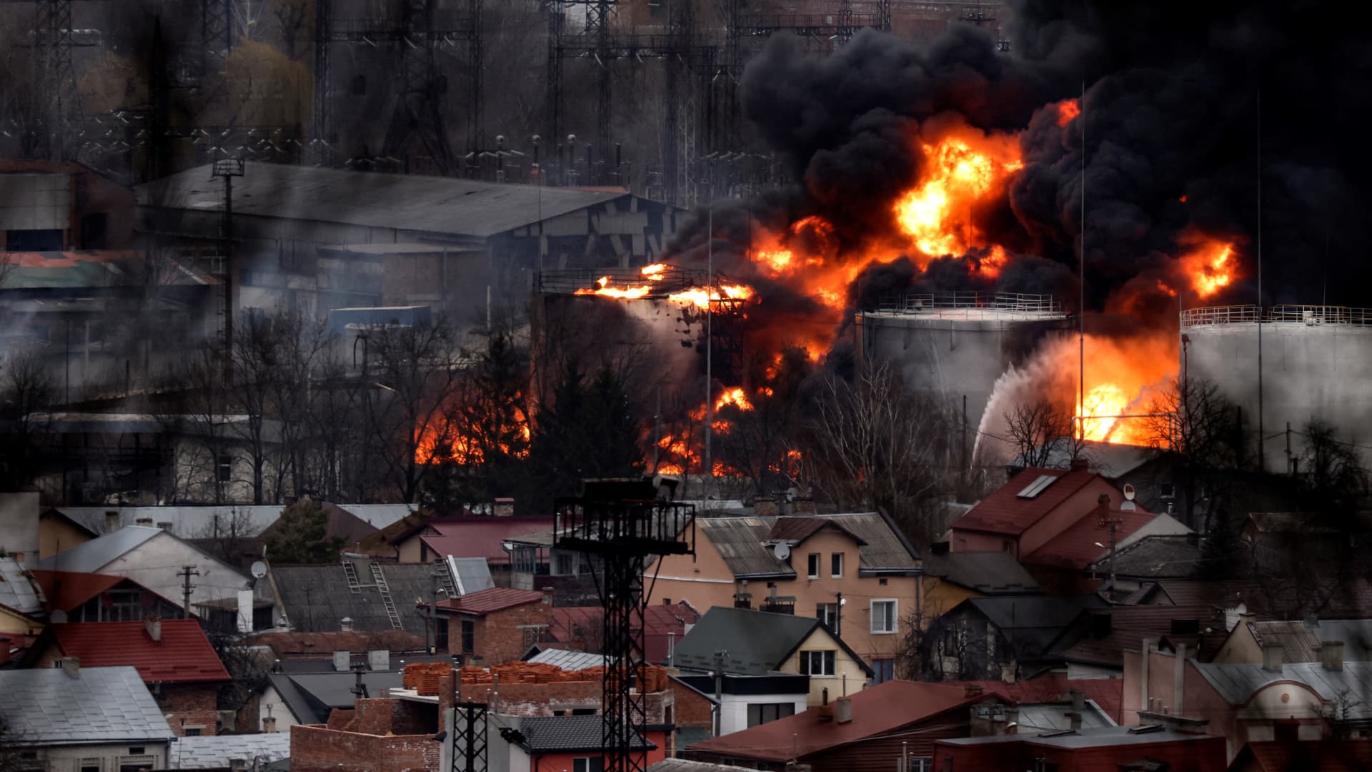 Dark smoke and flames rise from a fire following an air strike in the western Ukrainian city of Lviv, on March 26, 2022.
