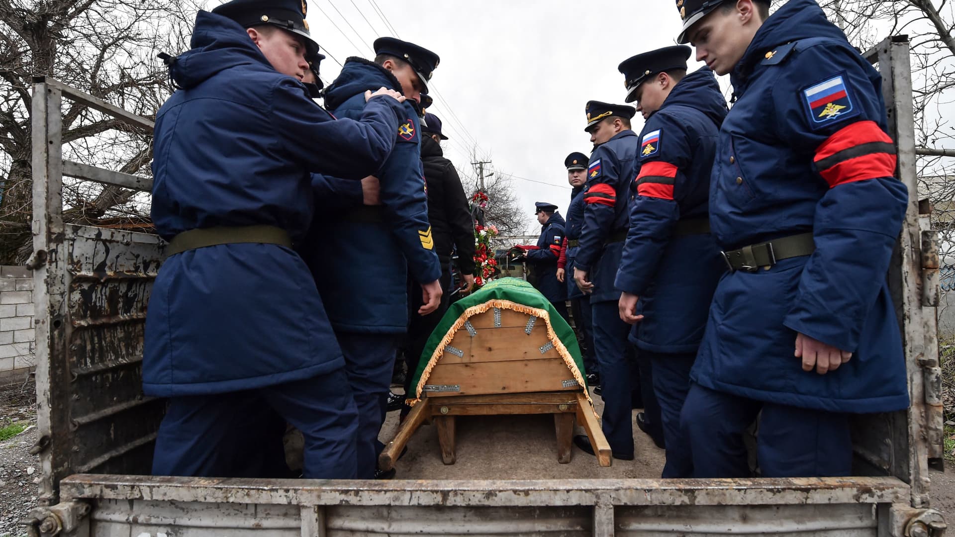 Honor guards attend a funeral of Rustam Zarifulin, 26, who died of wounds on March 14 during the outgoing Russian military action in Ukraine in the city of Kara-Balta some 60 kilometres from Bishkek on March 27, 2022.