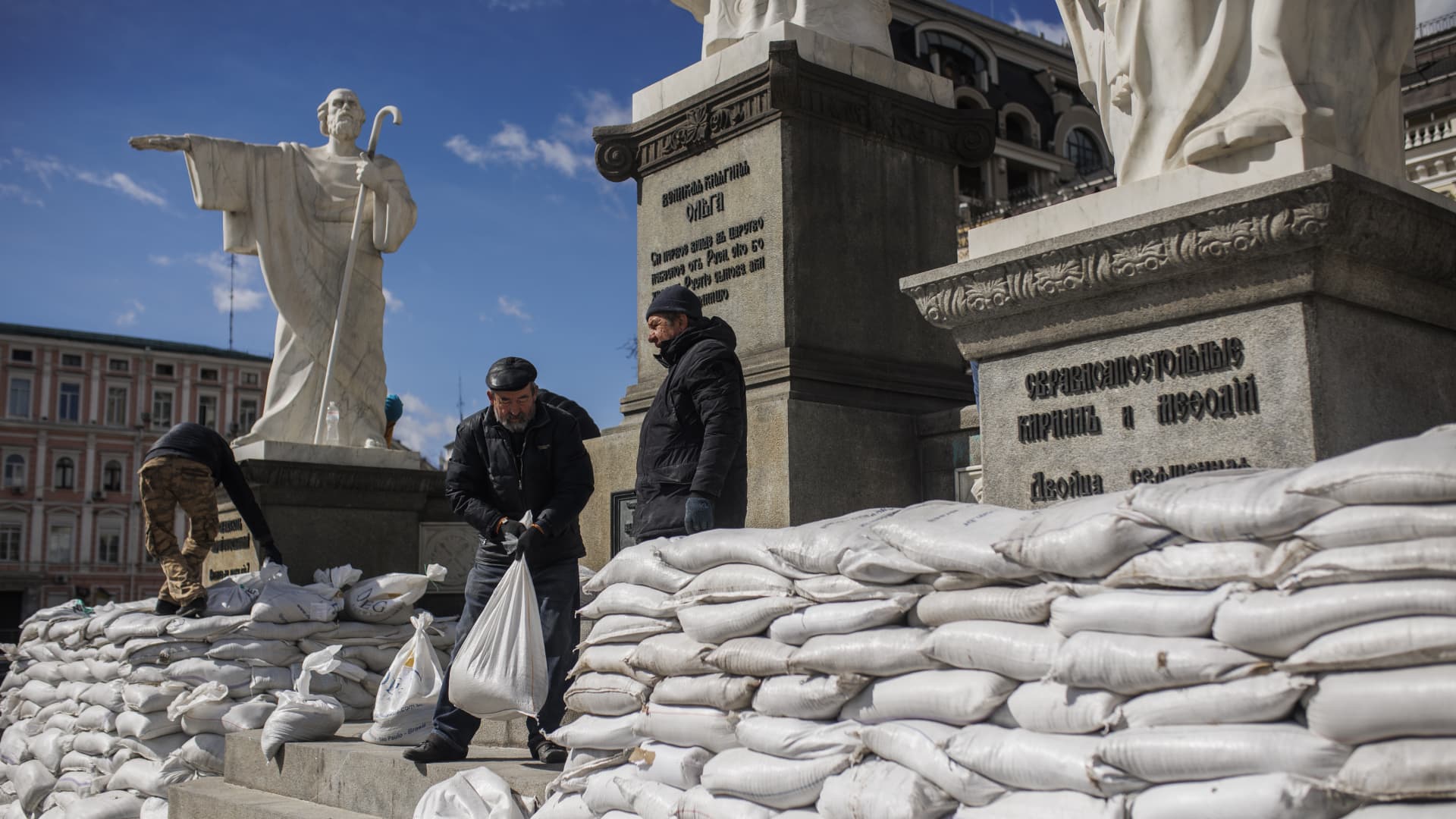 People prepare sand bags to cover statues in an effort to protect cultural and historical heritage amid Russian attacks in Kyiv, Ukraine on March 27, 2022.