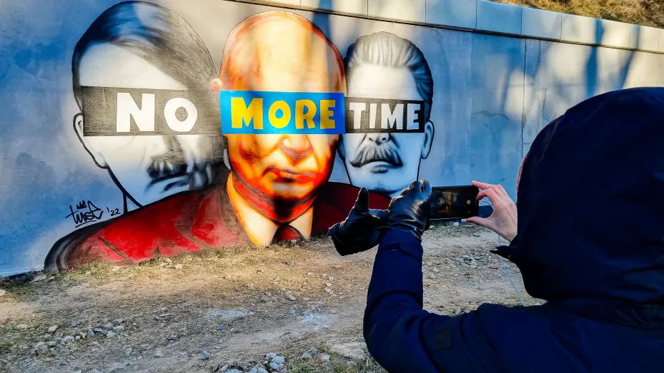 A mural of Putin, Hitler, and Stalin with a slogan " No More Time" is seen on the wall next to the PKM Gdansk Jasien train station.
