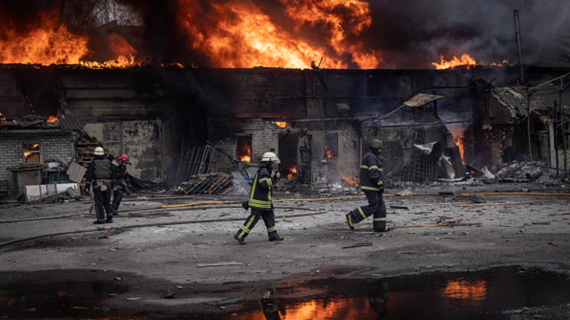 Firefighters work to extinguish a fire at a warehouse after it was hit by Russian shelling on March 28, 2022 in Kharkiv, Ukraine.