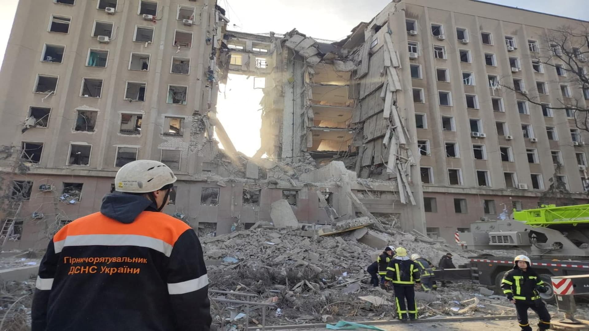 Rescuers work at a site of the regional administration building hit by cruise missiles, as Russia's attack on Ukraine continues, in Mykolaiv, in this handout picture released March 29, 2022. 