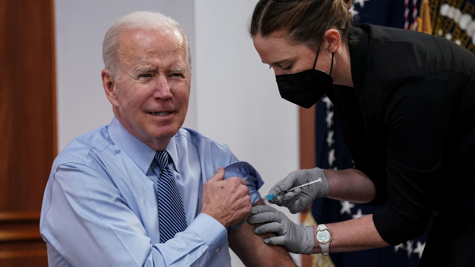 U.S. President Joe Biden receives a second coranavirus disease (COVID-19) booster vaccination after delivering remarks on COVID-19 in the Eisenhower Executive Office Building’s South Court Auditorium at the White House in Washington, U.S., March 30, 2022. 