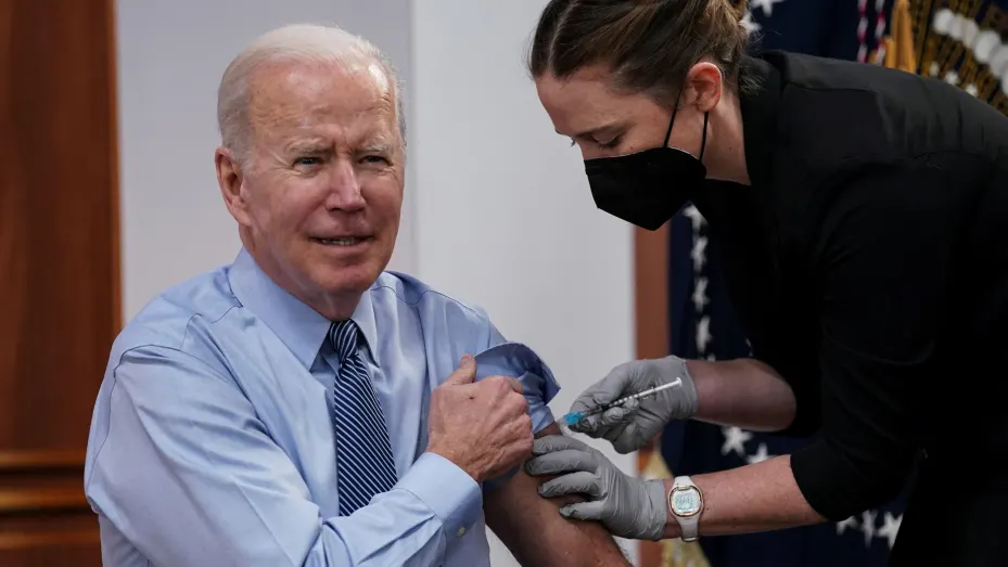 U.S. President Joe Biden receives a second coranavirus disease (COVID-19) booster vaccination after delivering remarks on COVID-19 in the Eisenhower Executive Office Building’s South Court Auditorium at the White House in Washington, U.S., March 30, 2022. REUTERS/Kevin Lamarque