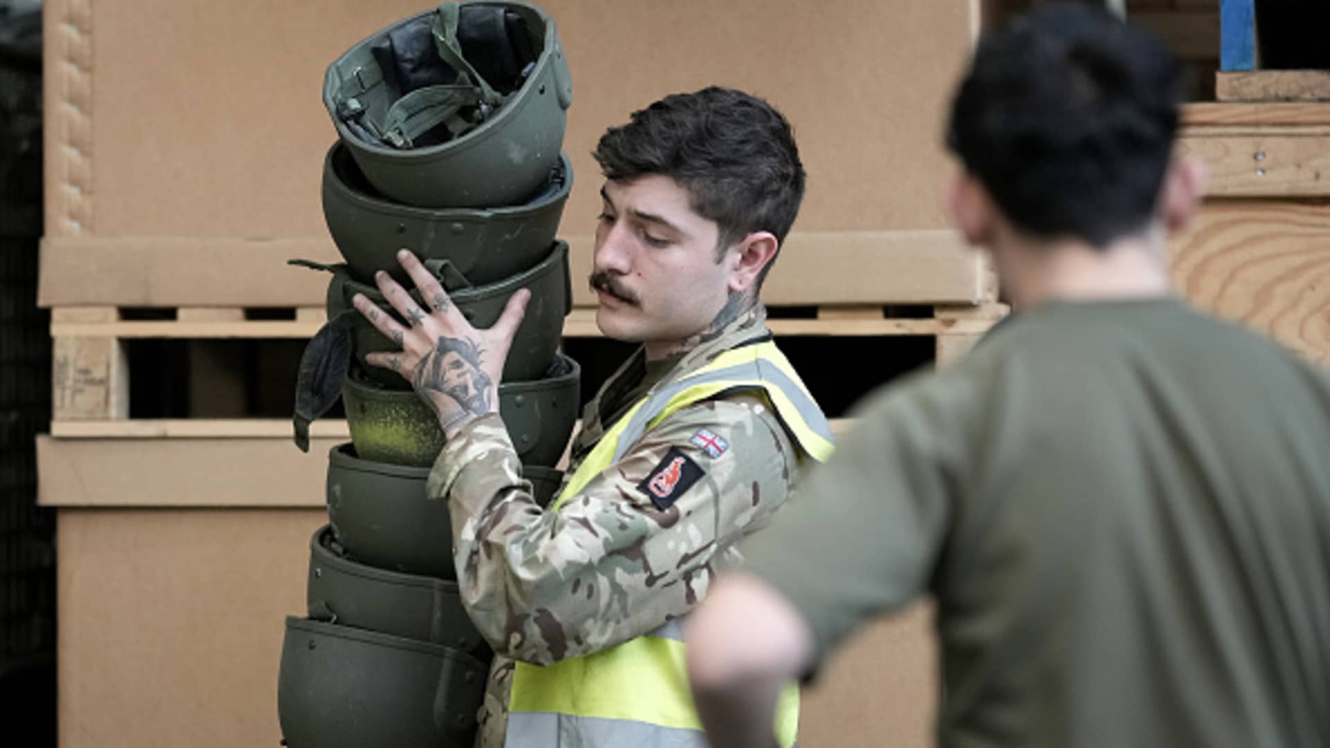 Soldiers from A Company , 2nd Battalion, The Royal Anglian Regiment sort and pack some of the surplus 84,000 ballistic helmets being shipped to armed forces and emergency workers in Ukraine on March 31, 2022 in Donnington, England. 