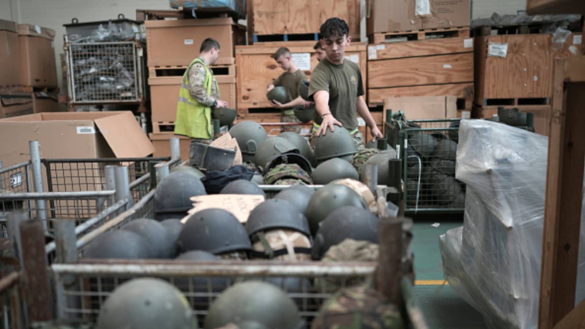 Soldiers from A Company , 2nd Battalion, The Royal Anglian Regiment sort and pack some of the surplus 84,000 ballistic helmets being shipped to armed forces and emergency workers in Ukraine on March 31, 2022 in Donnington, England. 