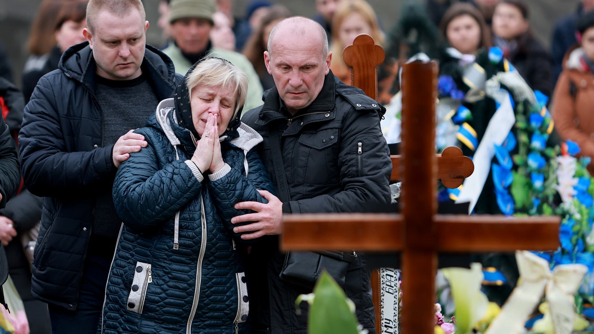 Relatives of Ukrainian military member, Yuriy Oliynyk, become emotional during his burial at the Lychakiv Cemetery on March 31, 2022 in Lviv, Ukraine.