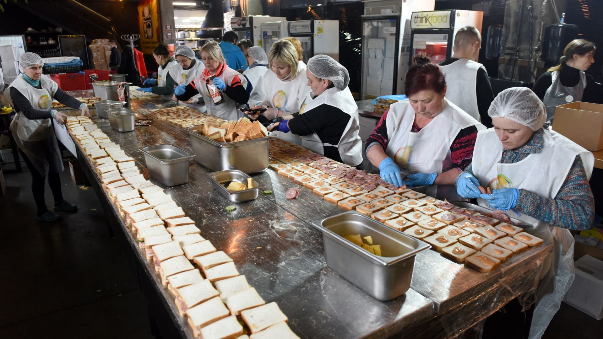 Employees of a local restaurants together with the World Central Kitchen organistion prepare hot food for refugees and Ukrainian Territorial Defense Forces in western Ukrainian city of Lviv on April 1, 2022. 