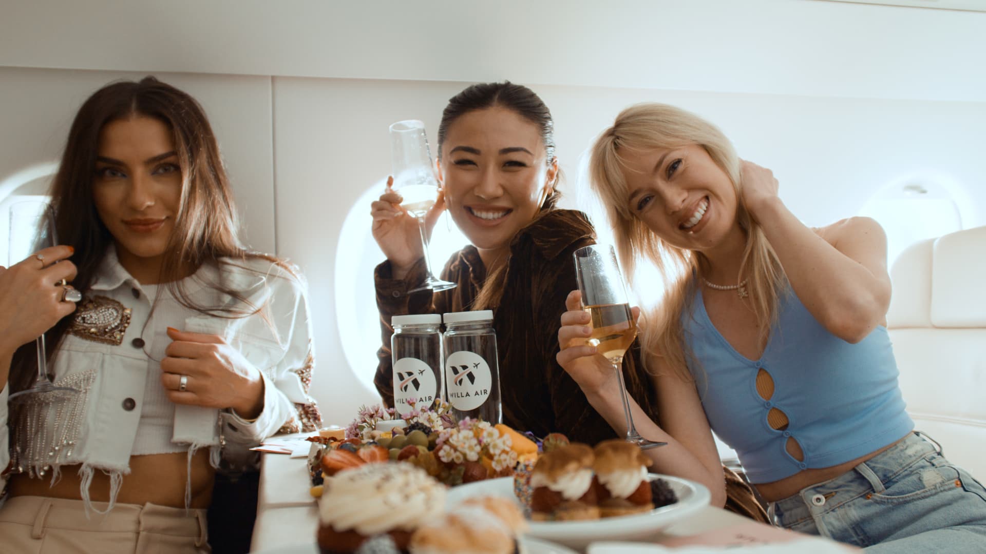 A promotional photo from Willa Air showing what passengers can expect on the new airline exclusively for creators and influencers.