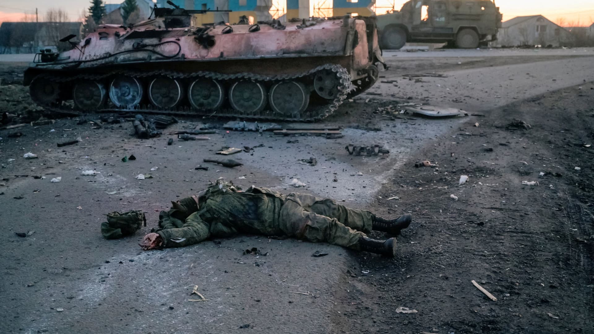 FILE PHOTO: SENSITIVE MATERIAL. THIS IMAGE MAY OFFEND OR DISTURBThe body of a soldier, without insignia, who the Ukrainian military claim is a Russian army serviceman killed in fighting, lies on a road outside the city of Kharkiv, Ukraine February 24, 2022. 