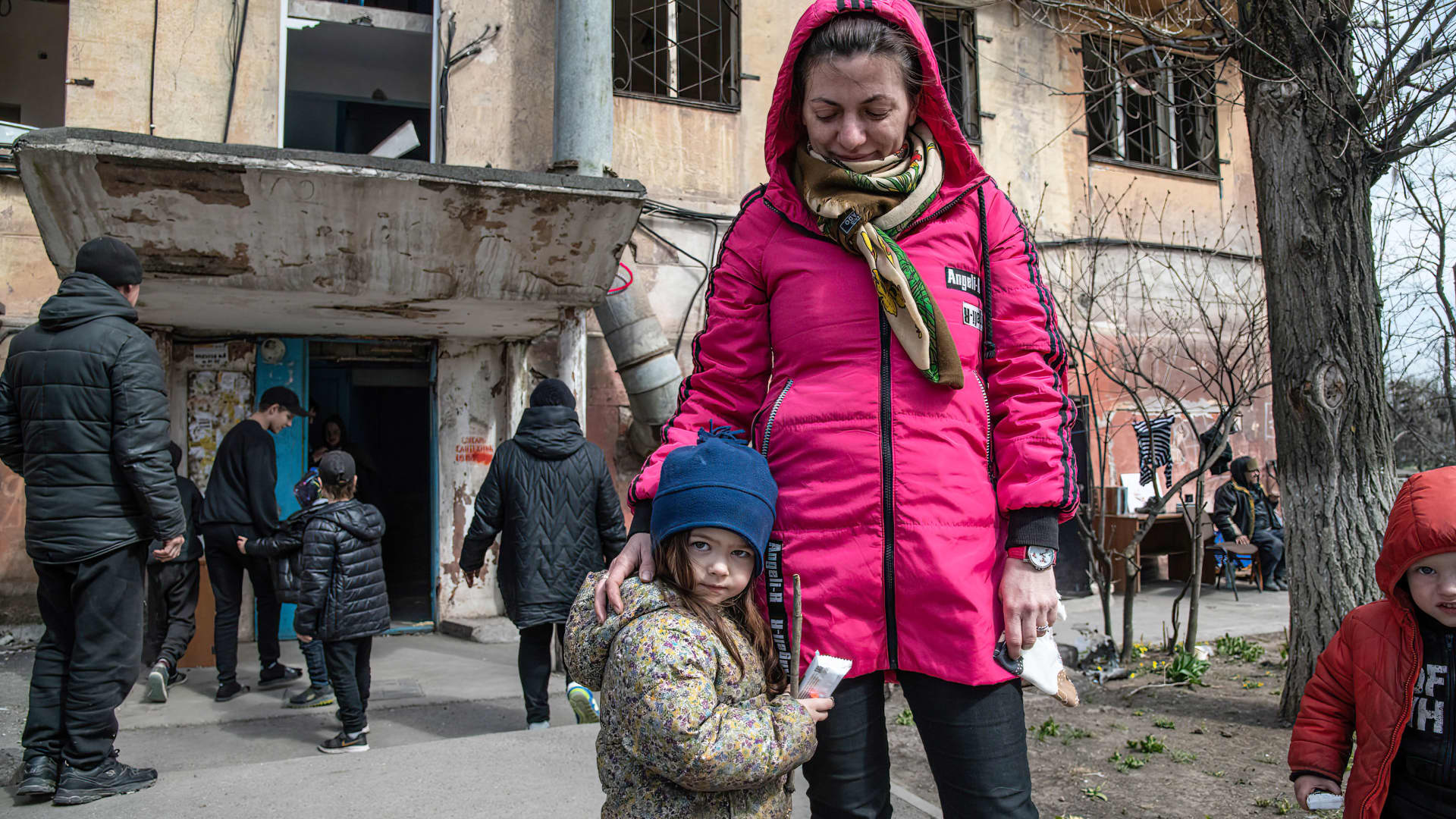 A mother and daughter outside their destroyed home in the port city of Mariupol.