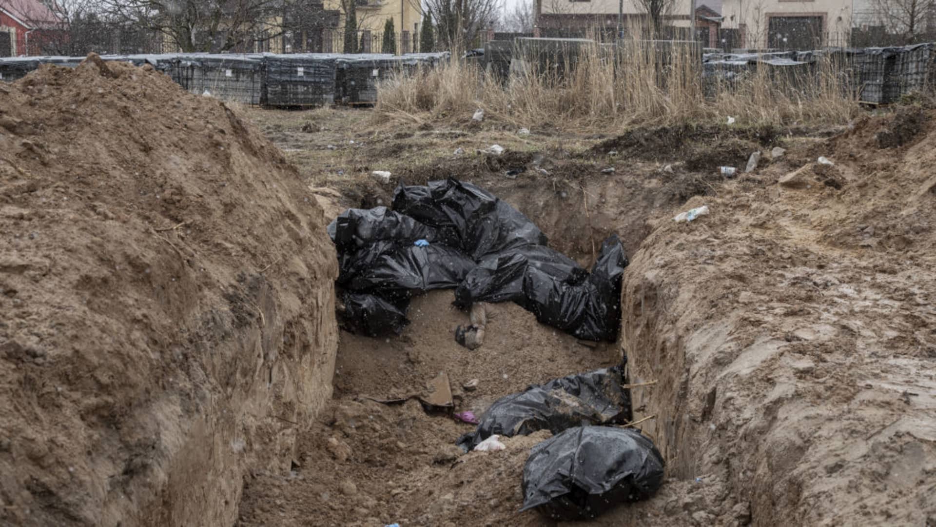 Bodies of civilians are seen in a mass grave in the town of Bucha, on the outskirts of Kyiv, after the Ukrainian army secured the area following the withdrawal of the Russian army from the Kyiv region on previous days, Bucha, Ukraine on April 03, 2022.