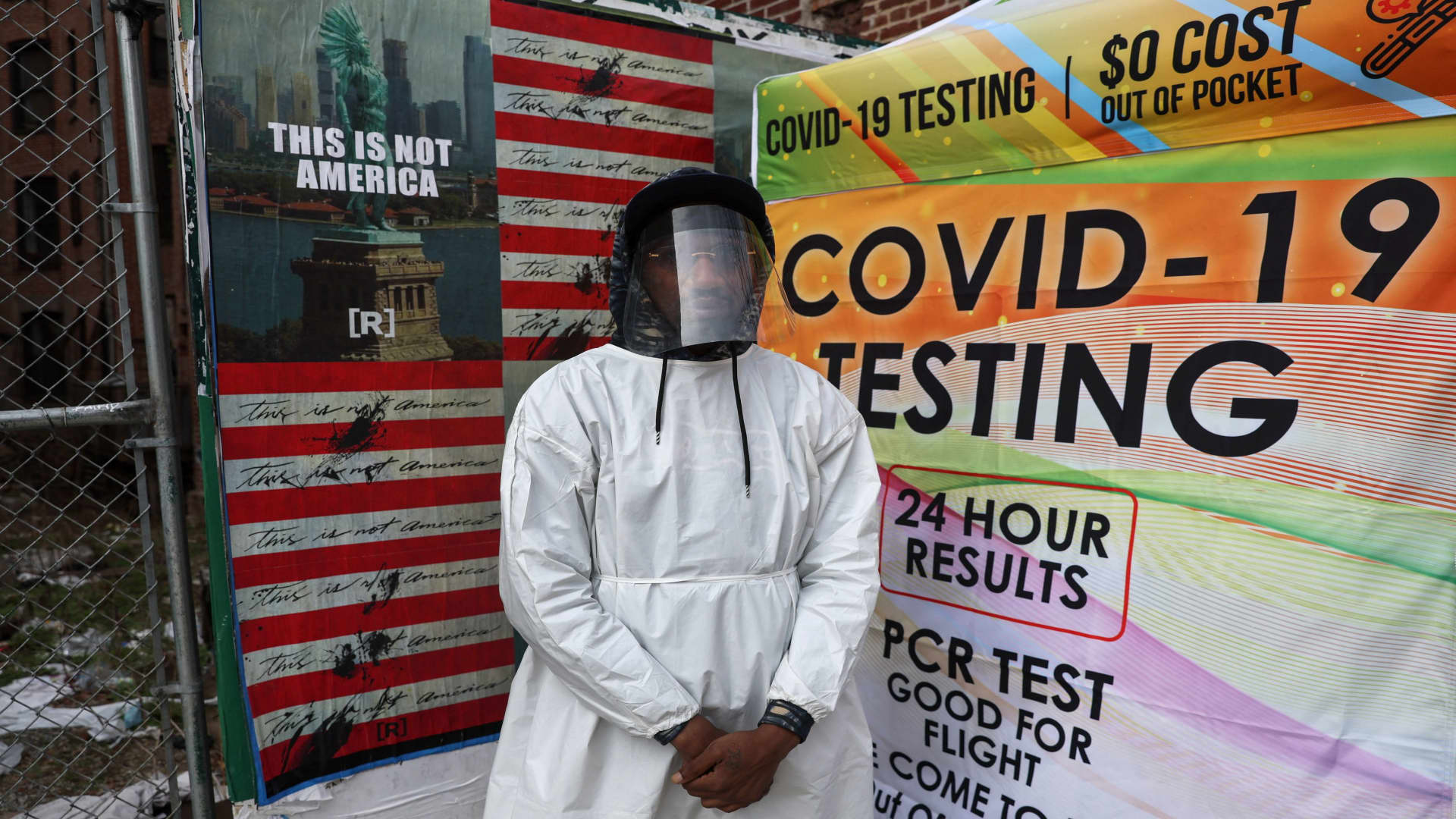 Kevon Jaskin, a health care administer, stands for a photograph by a mobile coronavirus disease (COVID-19)testing center on the Lower East Side of New York City, U.S., April 4, 2022. 