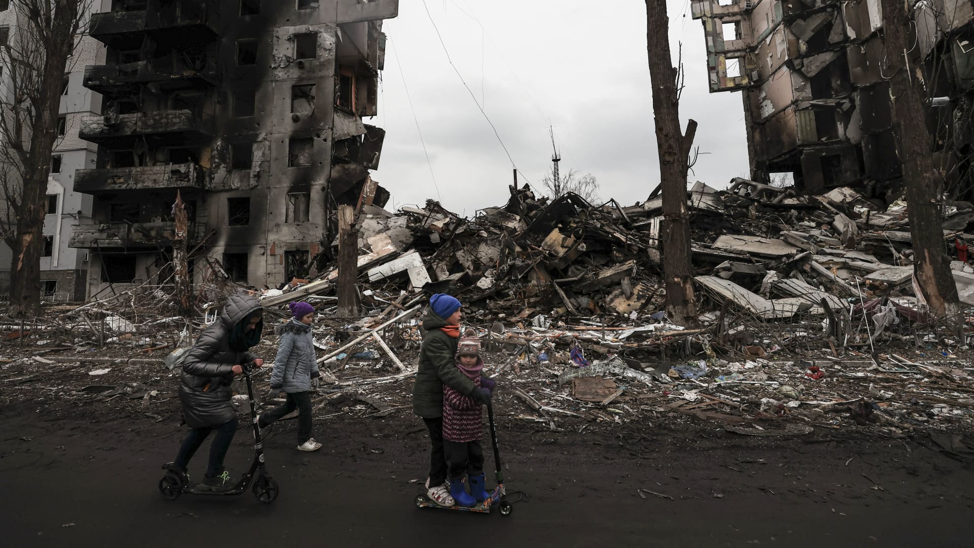 Ukrainian kids are seen playing among the ruins in the city of Borodyanka on April 5, 2022. Borodyanka was the scene of heavy clashes for weeks while the Russian military were located there until about four days ago.