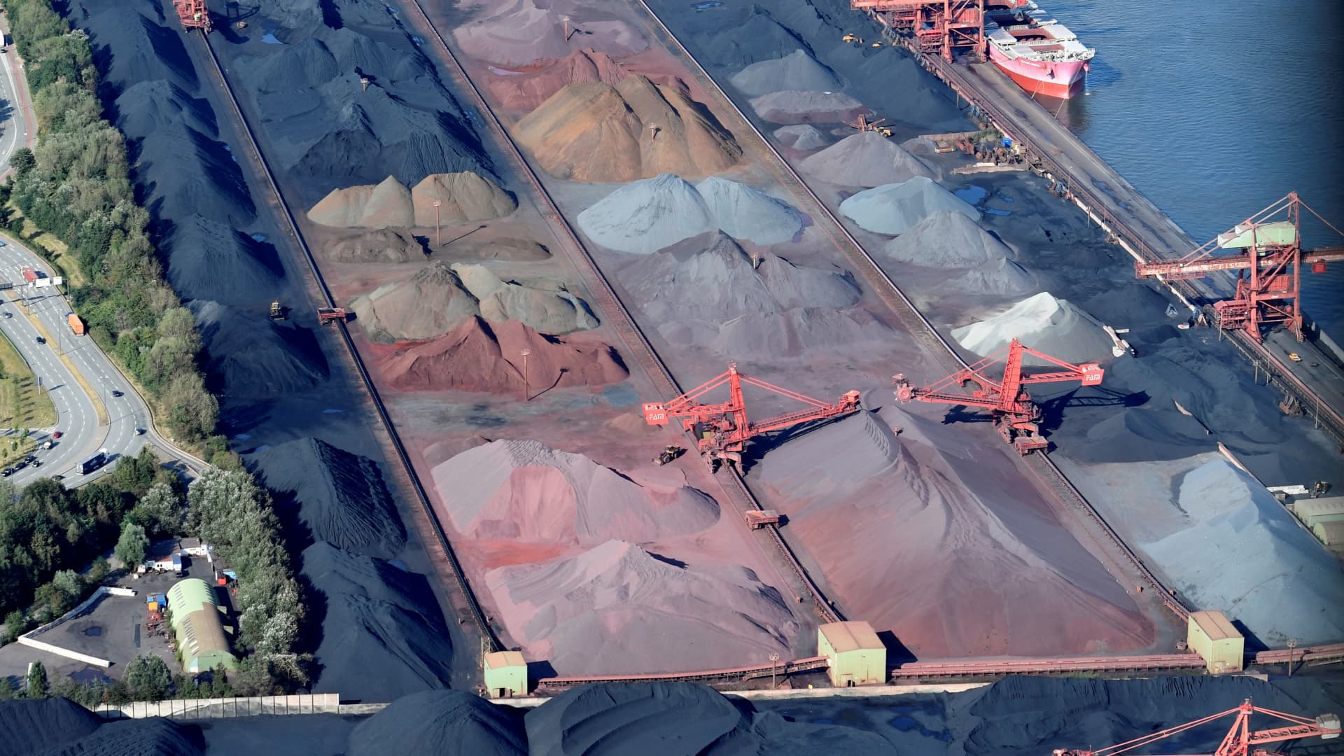 An aerial view of a dry bulk terminal of German company Hansaport, who is specialised in handling coal and ore, in the harbor of Hamburg, Germany, August 1, 2018. Picture taken through a plane's window August 1, 2018. 