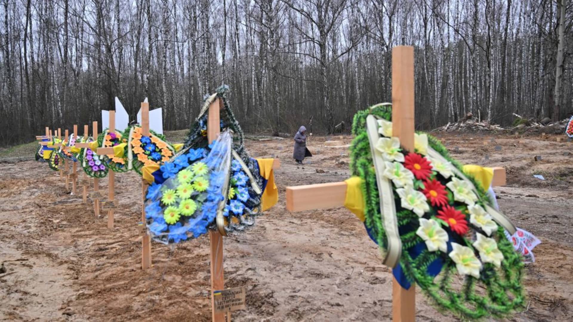 A resident searches for the graves of relatives in a cemetery in Chernihiv, northern Ukraine, on April 5, 2022.