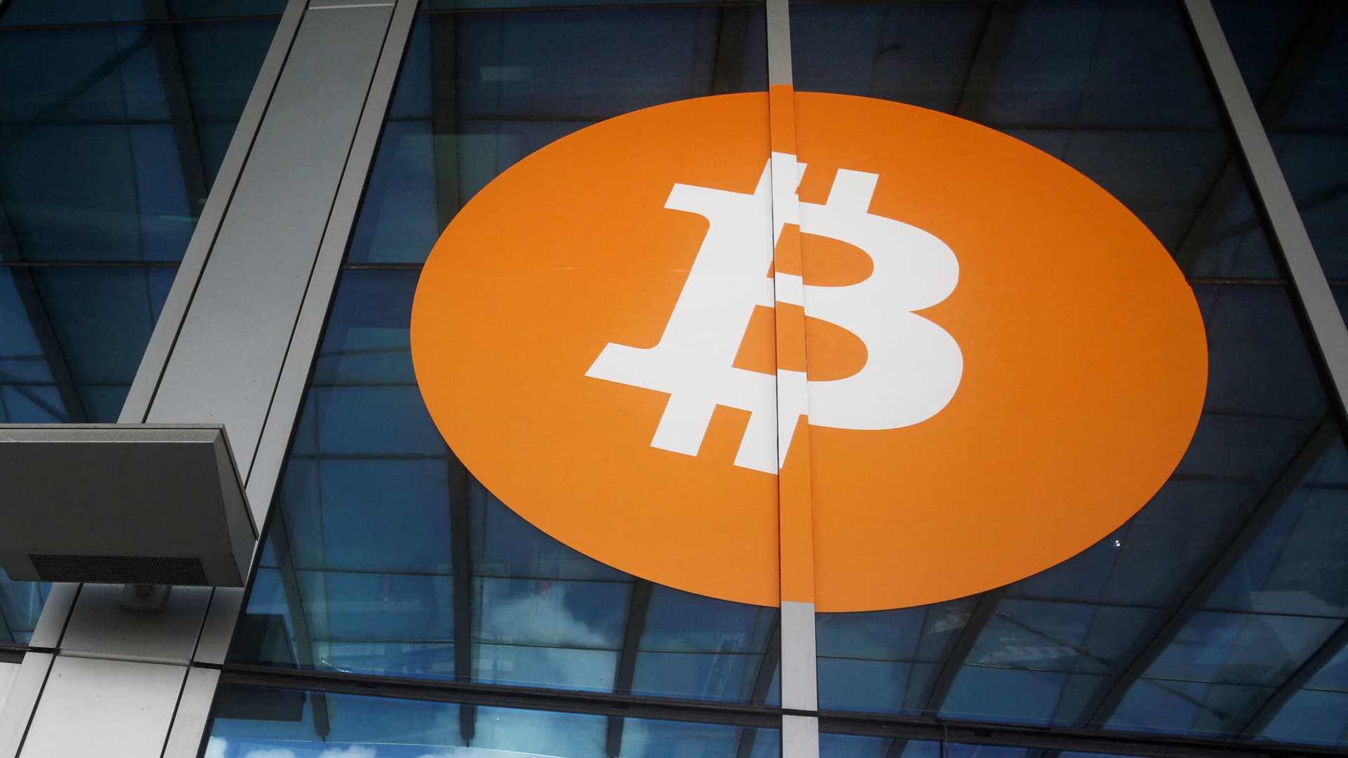 A bitcoin logo is seen at the entrance of the Miami Beach Convention Center during the Bitcoin Conference 2022 in Miami Beach, Florida, April 6, 2022.