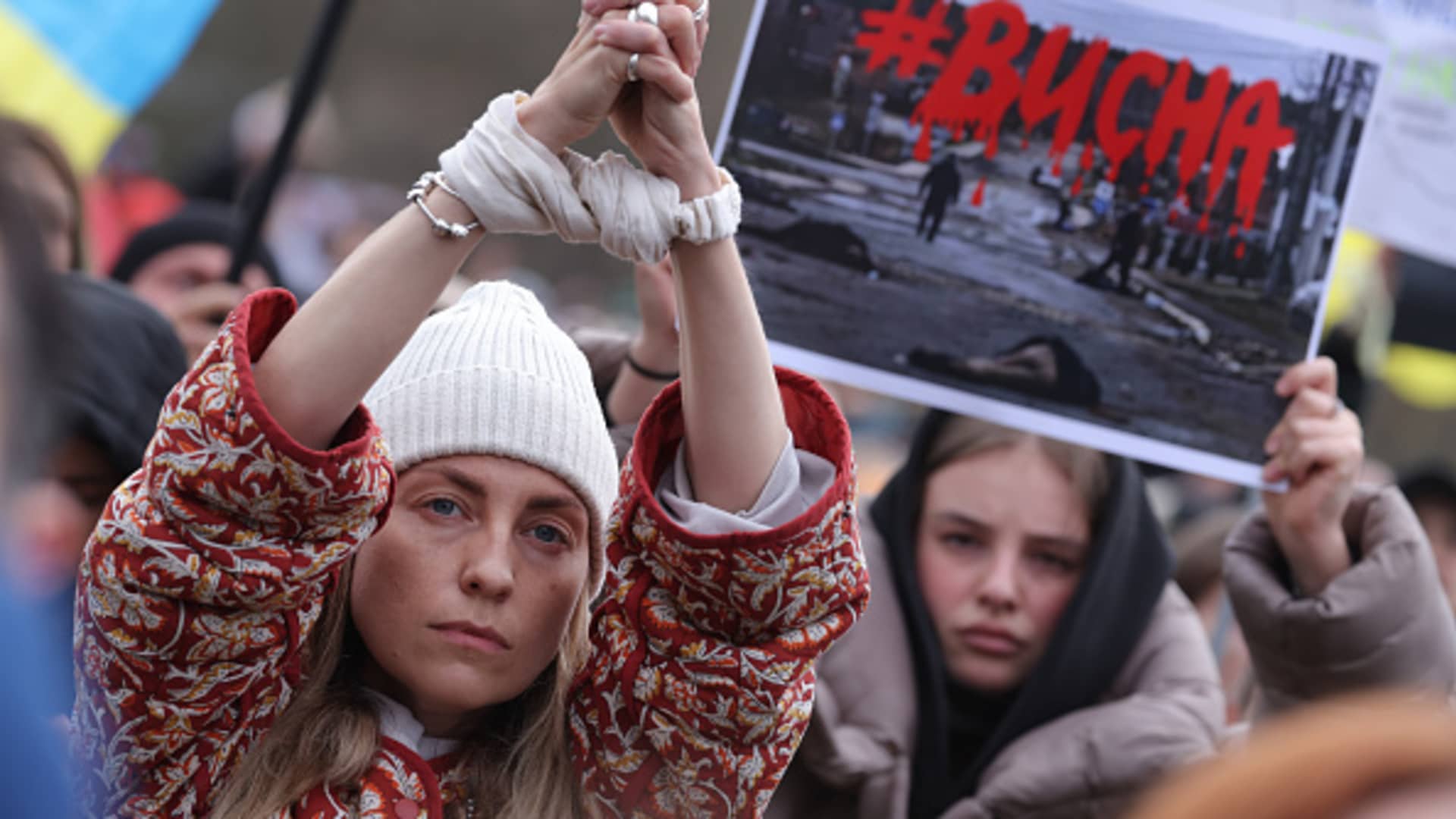 A protester holds up her hands symbolically bound in reference to the bound and murdered civilians of the Ukrainian town of Bucha near Kyiv during a demonstration against the Russian military invasion of Ukraine on April 06, 2022 in Berlin, Germany.