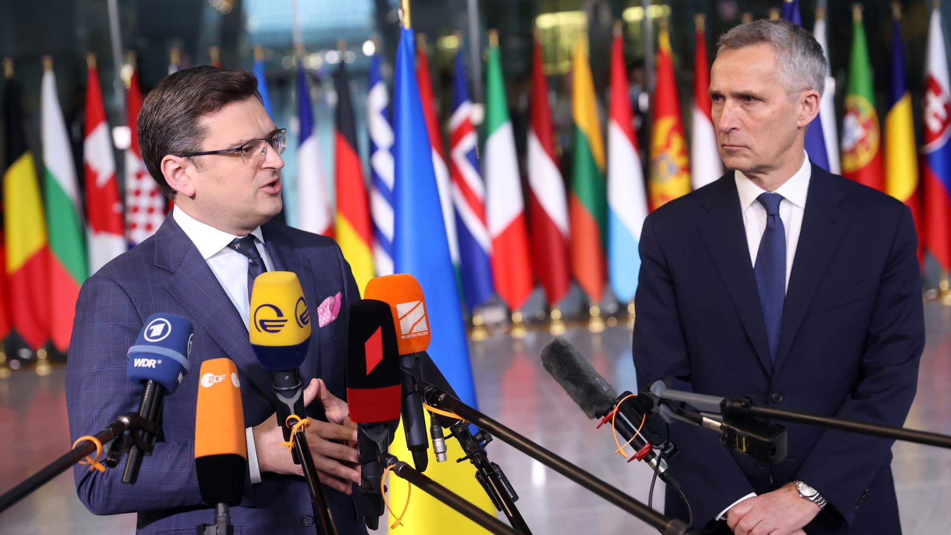 Ukraine's Foreign Minister Dmytro Kuleba (L) and NATO Secretary General Jens Stoltenberg give a press conference before a meeting of NATO foreign ministers at NATO headquarters, in Brussels, on April 7, 2022.