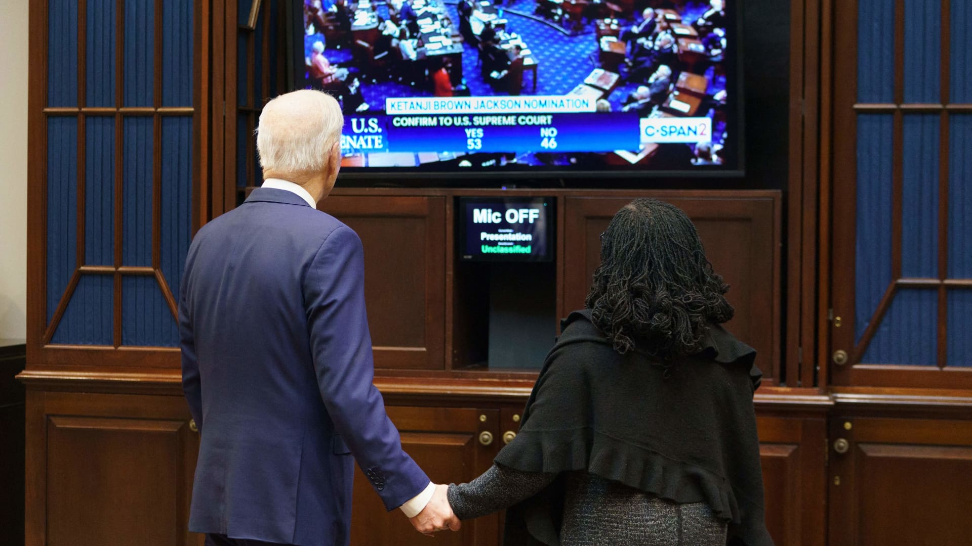 US President Joe Biden and judge Ketanji Brown Jackson watch the Senate vote on her nomination to an an associate justice on the US Supreme Court, from the Roosevelt Room of the White House in Washington, DC on April 7, 2022.