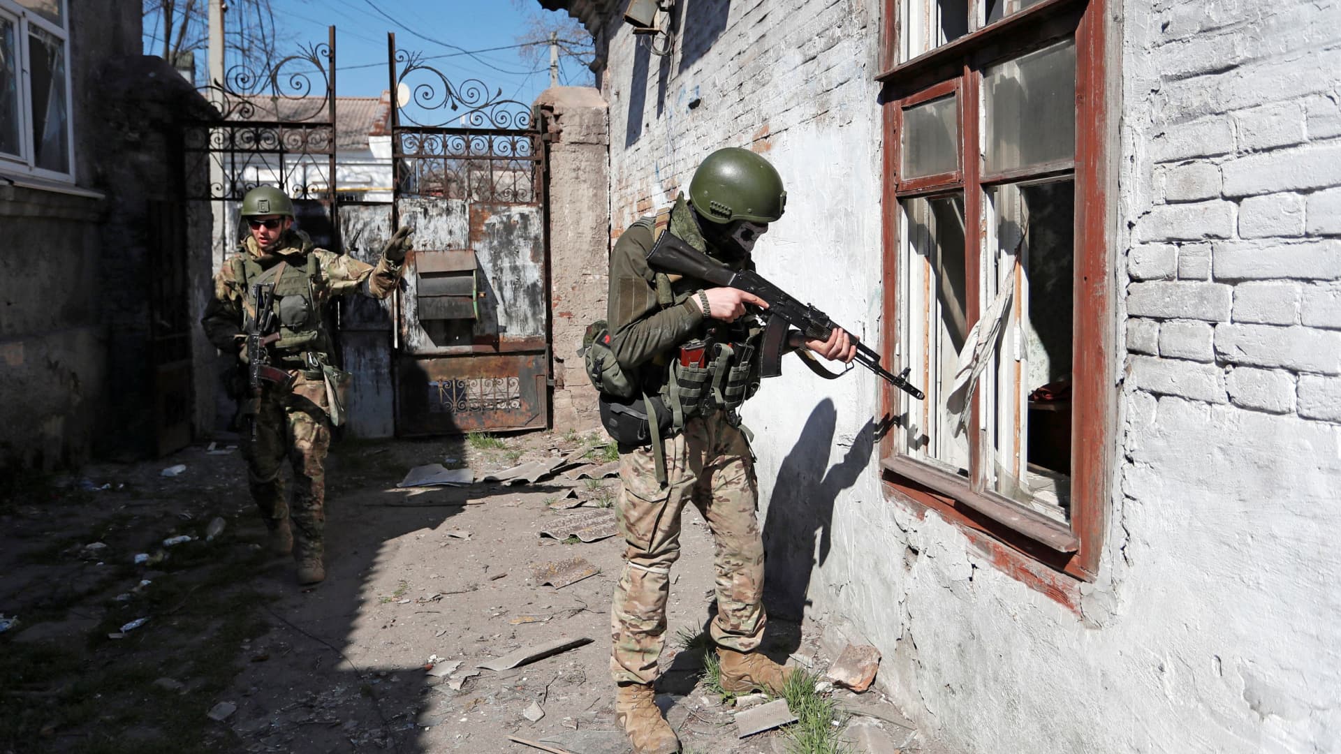 Service members of pro-Russian troops carry out a search of a house during Ukraine-Russia conflict in the southern port city of Mariupol, Ukraine April 7, 2022.