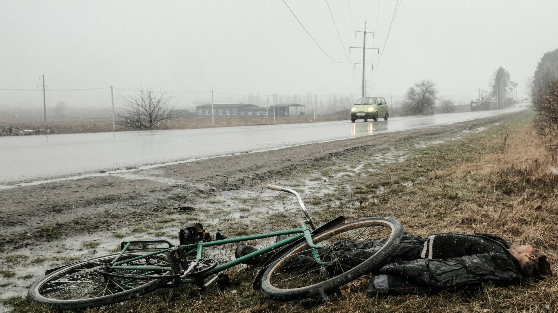 A dead body lays strewn on the ground next to a bicycle on the outskirts of Bucha, Ukraine. Scores of civilians are thought to have been killed by Russian troops while trying to flee the city to the northwest of Kyiv.