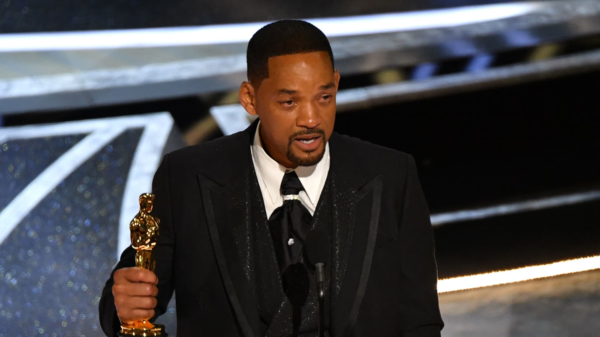 Will Smith banned from attending the Oscars for 10 years after slapping Chris Ro..