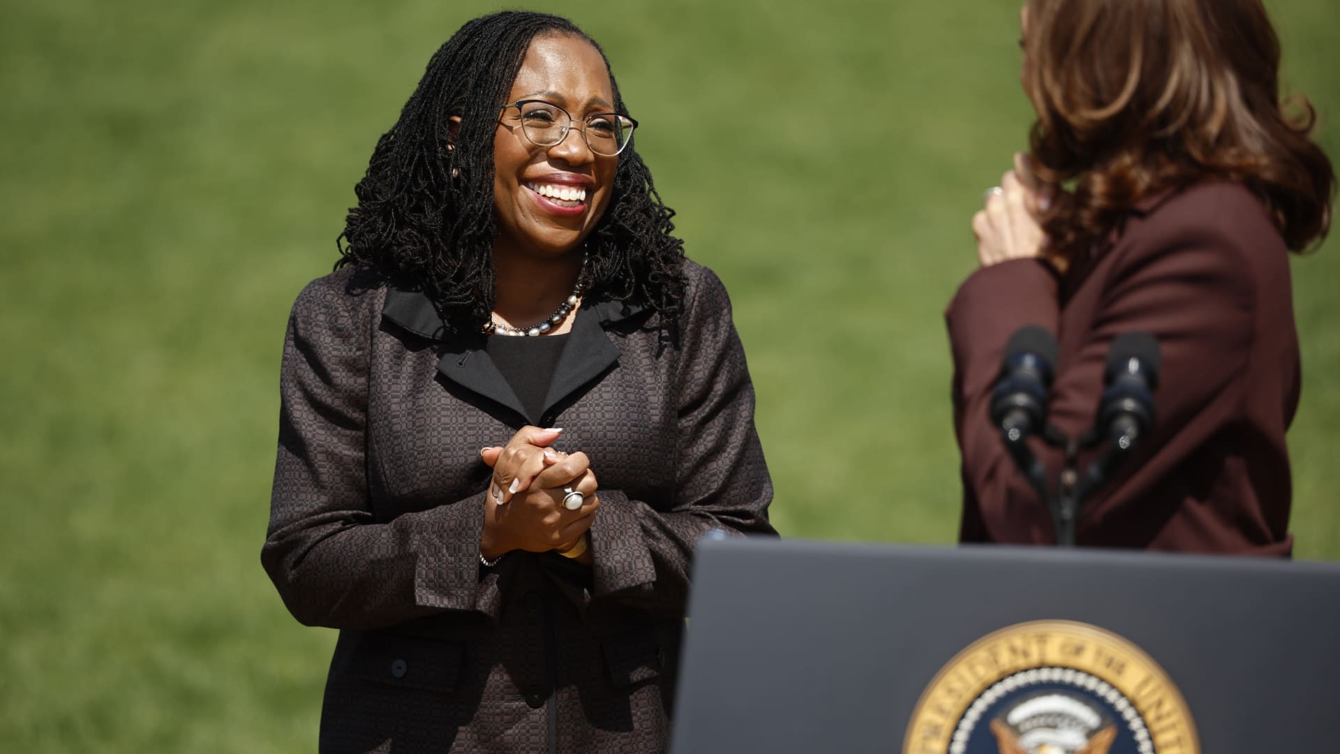 Judge Ketanji Brown Jackson smiles as Vice President Kamala Harris speaks at an event celebrating her confirmation to the U.S. Supreme Court on the South Lawn of the White House on April 8, 2022 in Washington, DC.