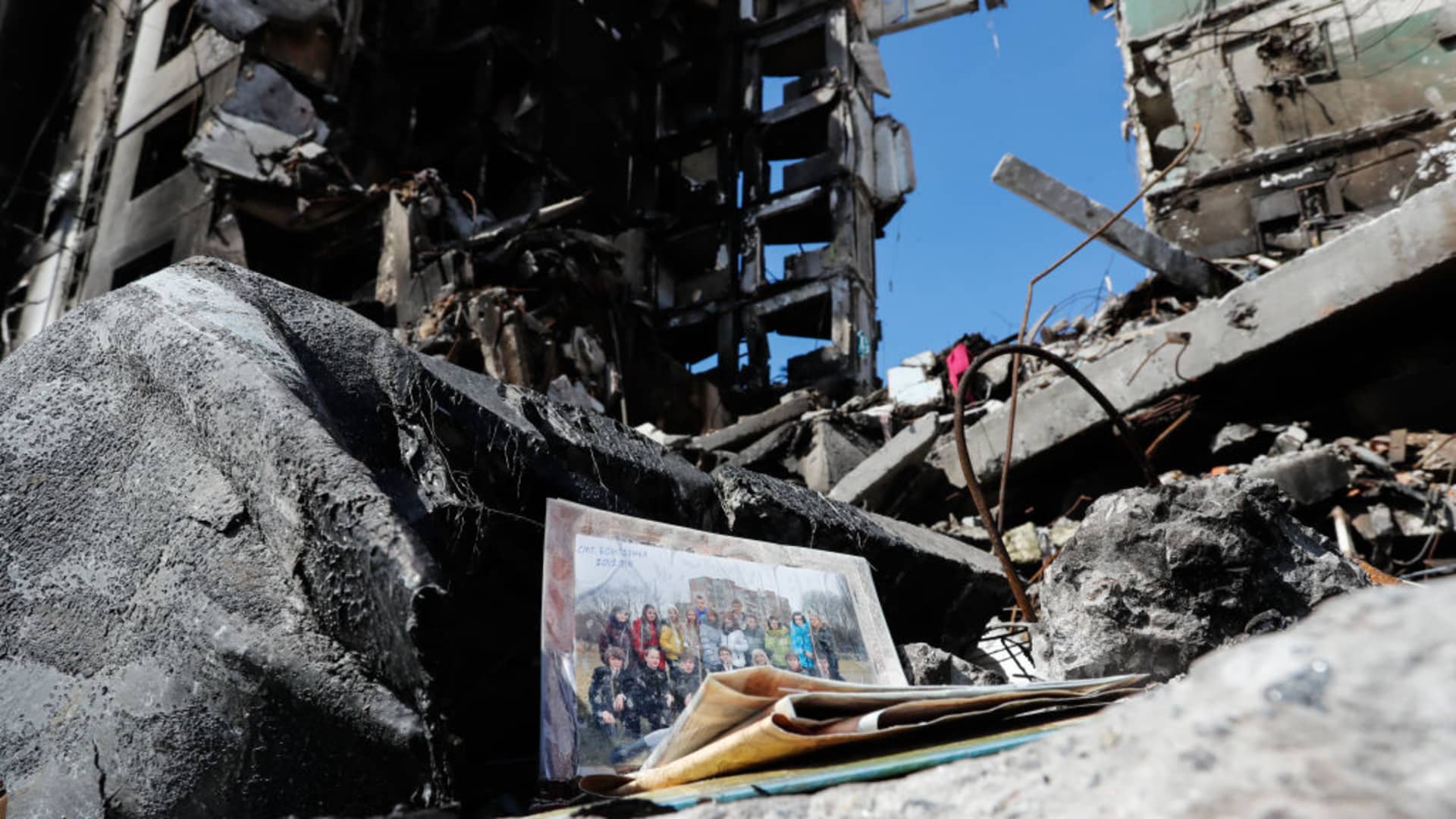 A group photo of Ukrainians is seen in the wreckage of a damaged residential building by the Russian air raids in Borodyanka, Bucha Raion of Kyiv Oblast, on 7 April 2022.