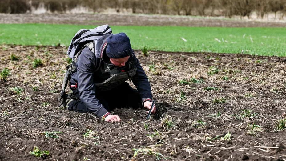 A farmer wears a bulletproof vest during crop sowing near the Zaporizhzhia Region, southeastern Ukraine.