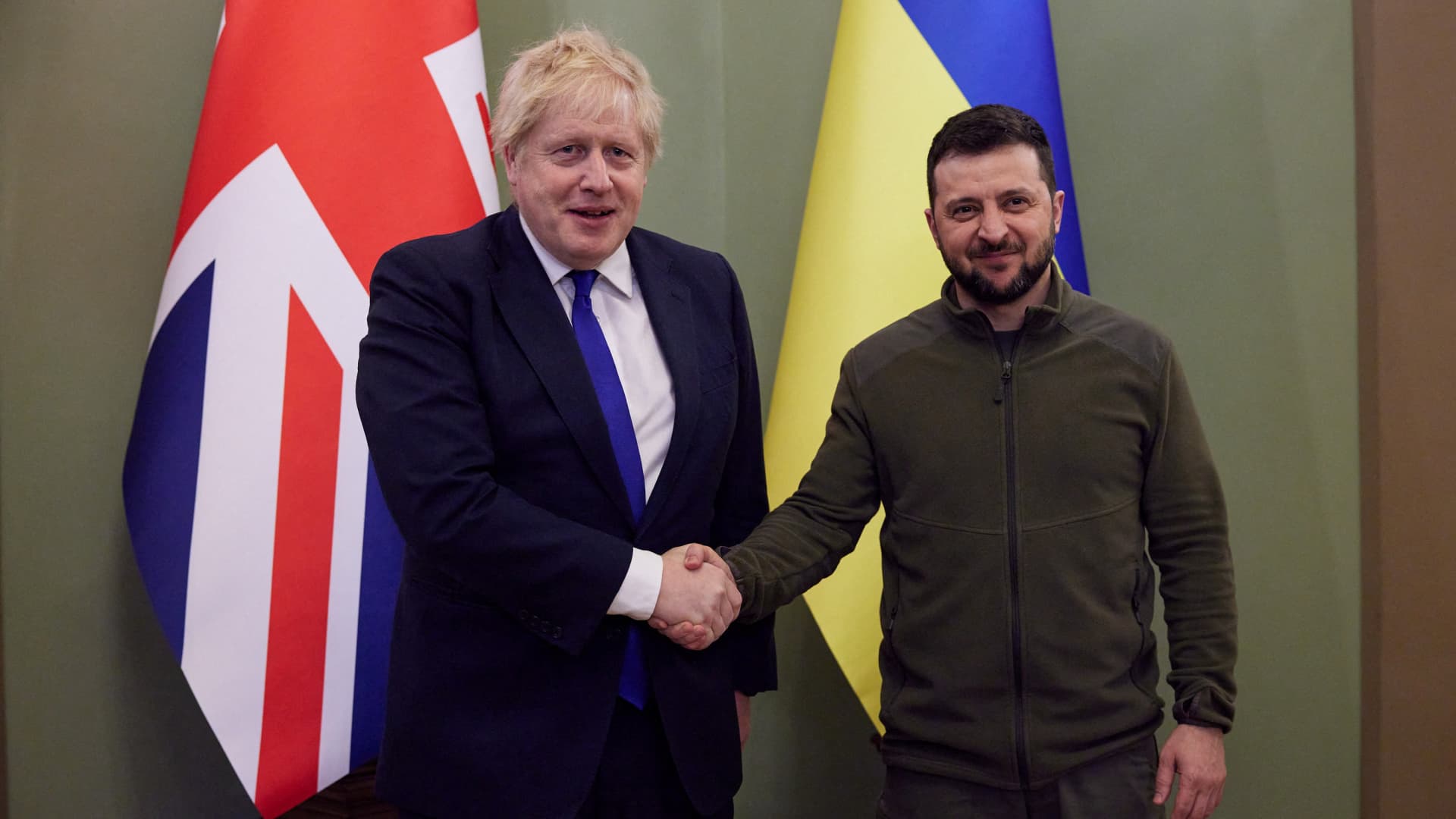Ukraine's President Volodymyr Zelenskiy and British Prime Minister Boris Johnson shake hands before a meeting, as Russia's attack on Ukraine continues, in Kyiv, Ukraine April 9, 2022. 