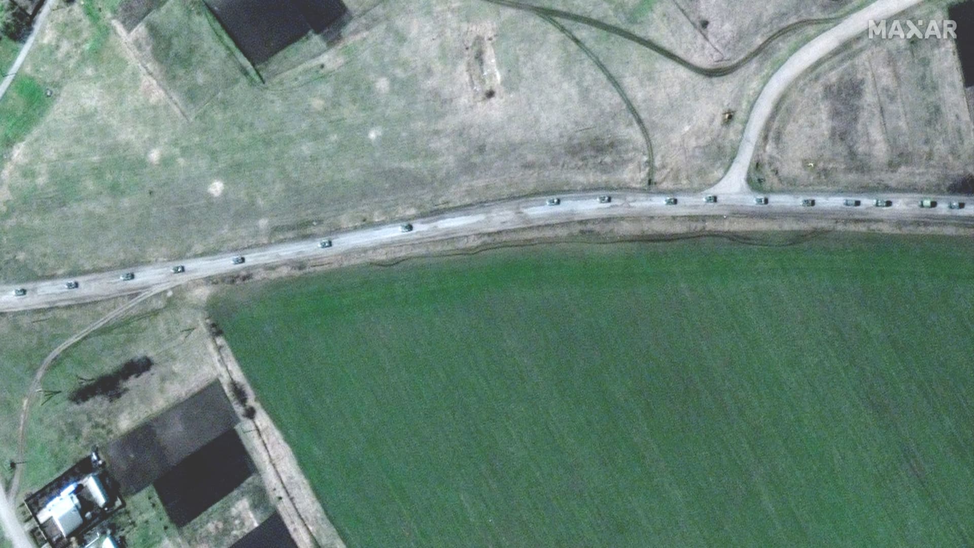A satellite image shows armoured vehicles at the northern end of a military convoy moving south through the Ukrainian town of Velykyi Burluk, Ukraine, April 8, 2022. 