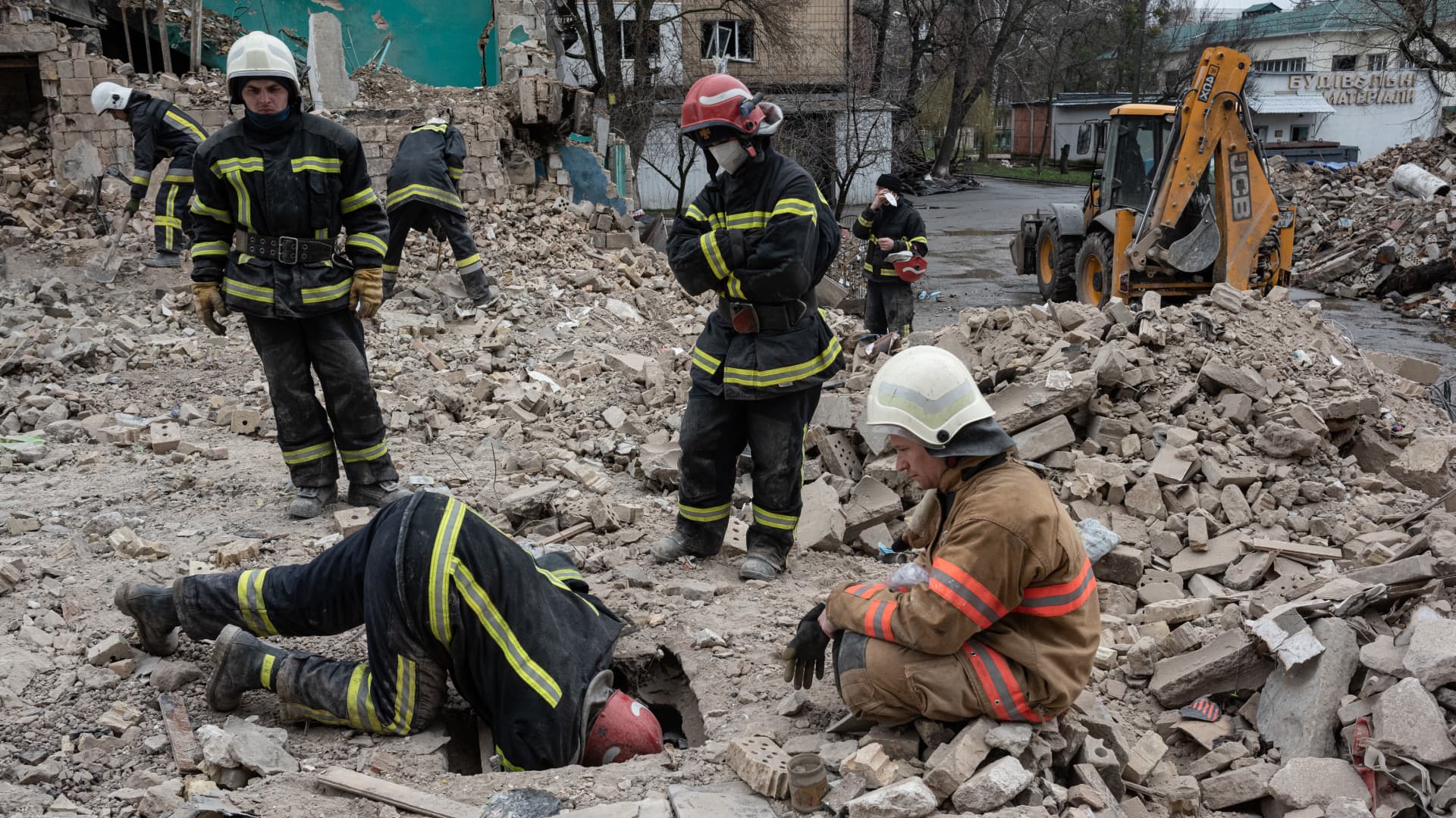 Rescue workers clear the rubble of an apartment building on April 9, 2022 in Borodianka, Ukraine. 