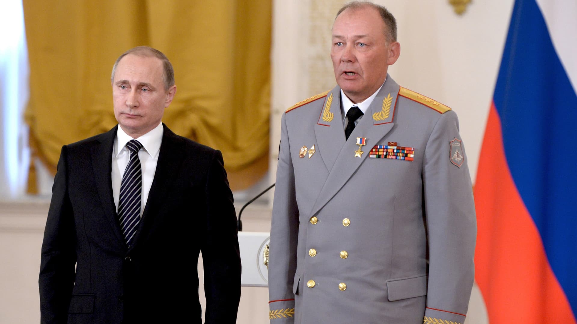In this photo taken on March 17, 2016, Russian President Vladimir Putin, left, poses with Col. Gen. Alexander Dvornikov during an awarding ceremony in Moscow's Kremlin, Russia.