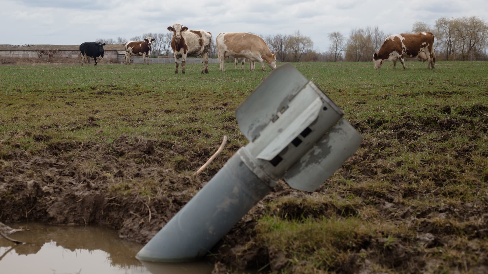 A Russian ballistic weapon lies in the middle of a Ukrainian farmer's field. Russian disruption of Ukrainian commerce is seen taking a staggering 45.1% off Ukraine's GDP this year, according to the World Bank.