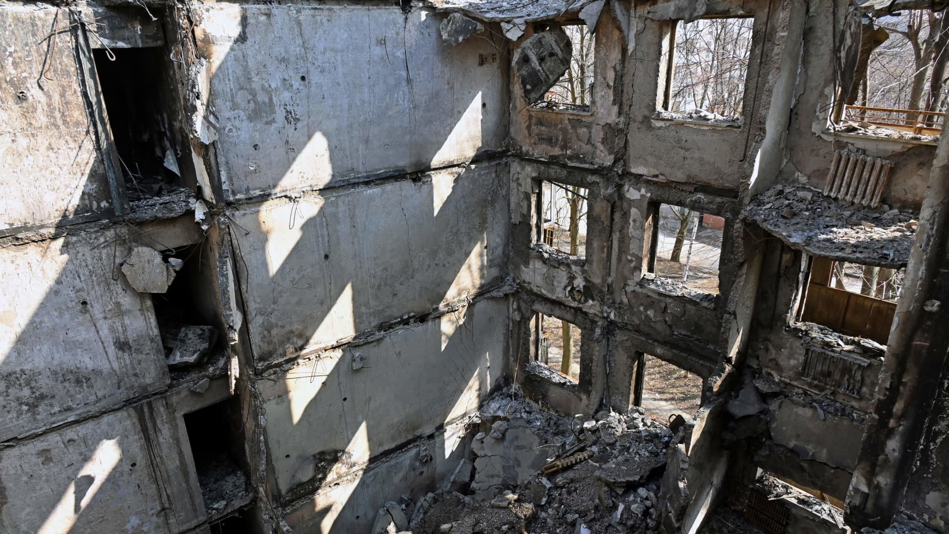 This photograph shows a partially destroyed five storey residential building in the Ukrainian city of Kharkiv, on April 10, 2022, amid the Russian invasion of Ukraine.