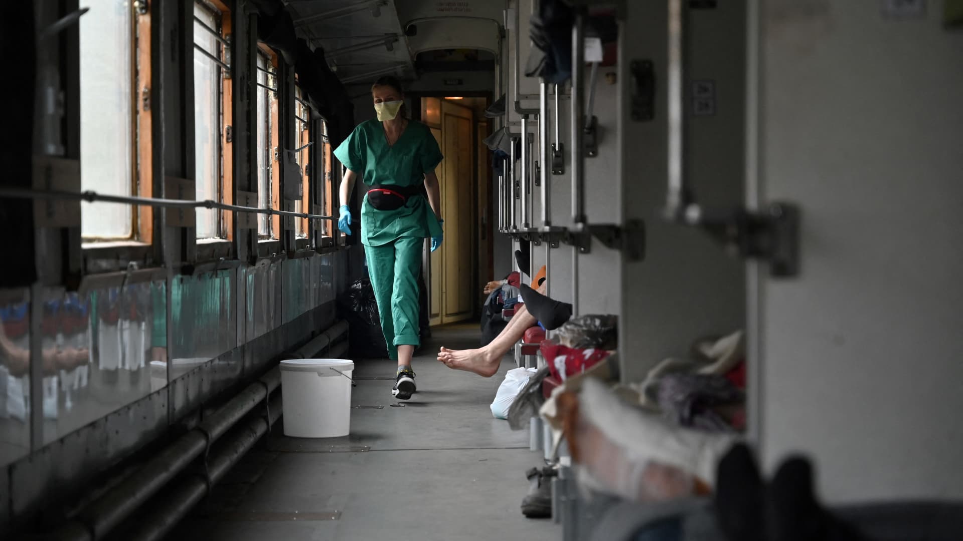 Elena, 33, a team member of Doctors Without Borders, cares for patients on a medical evacuation train on its way to the western Ukrainian city of Lviv on April 10, 2022.