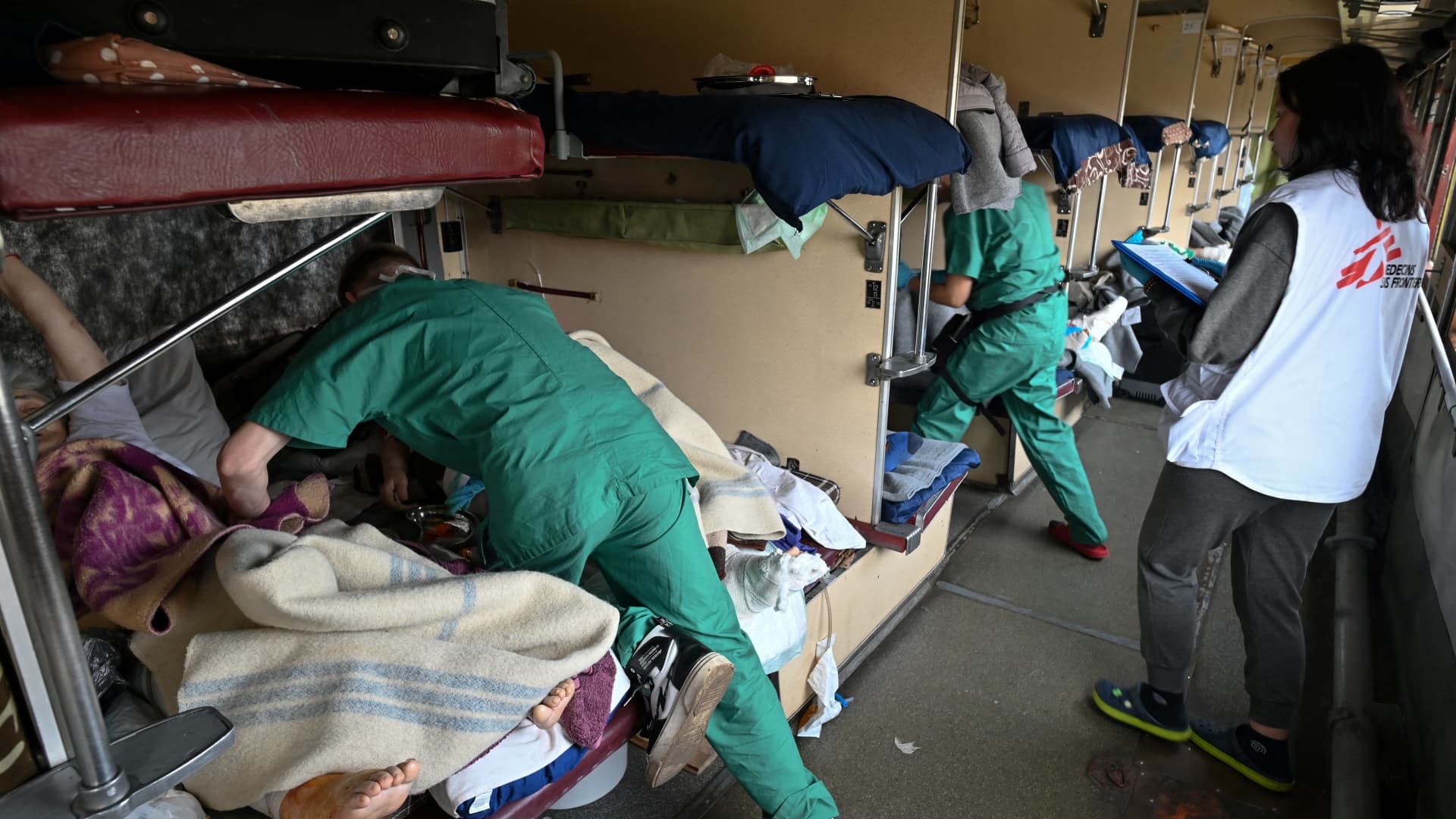 An MSF team care for patients on a medical evacuation train on its way to the western Ukrainian city of Lviv on April 10, 2022. 