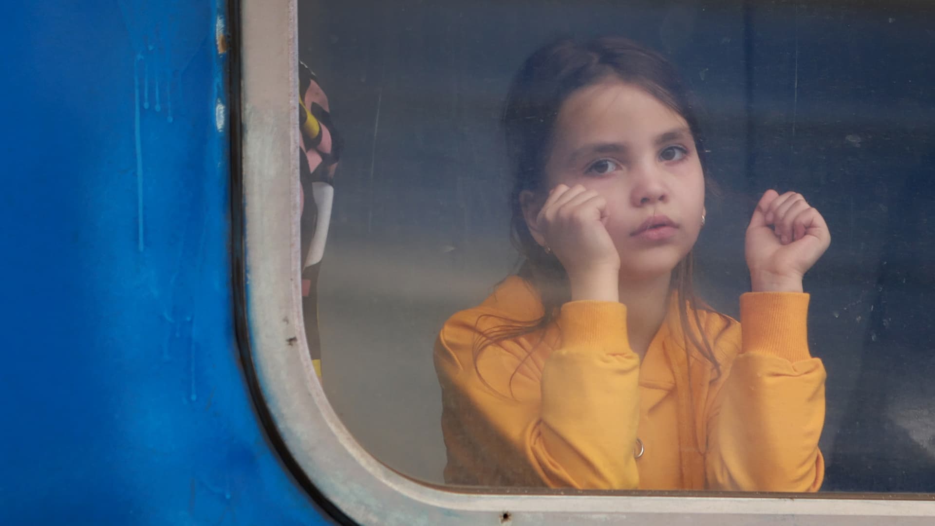 A child waits on the train to Poland at the central train station on April 11, 2022 in Lviv, Ukraine.
