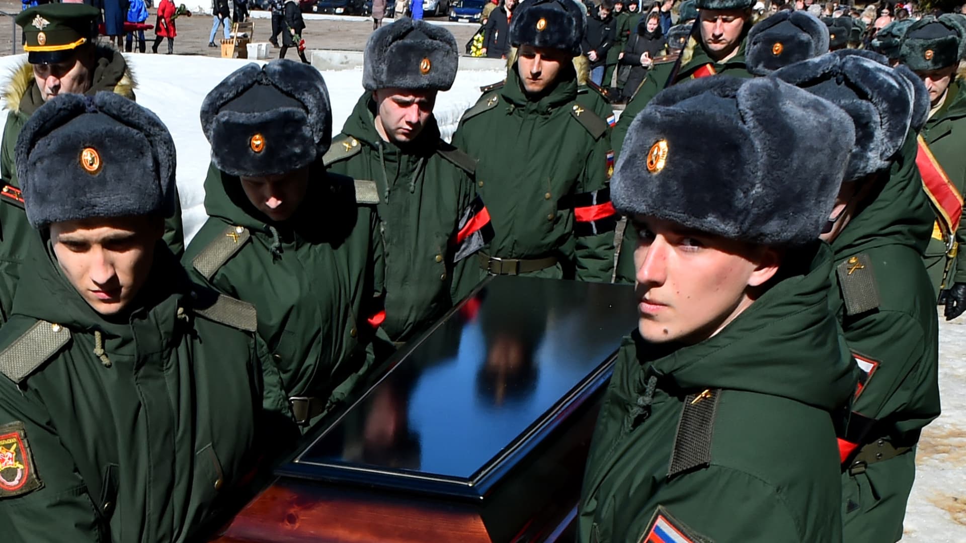 Soldiers carry a coffin of 20-year-old Russian serviceman Nikita Avrov, during his funeral at a church in Luga some 150kms south of Saint Petersburg on April 11, 2022, after his death on March 27, during the ongoing Russian invasion of Ukraine.