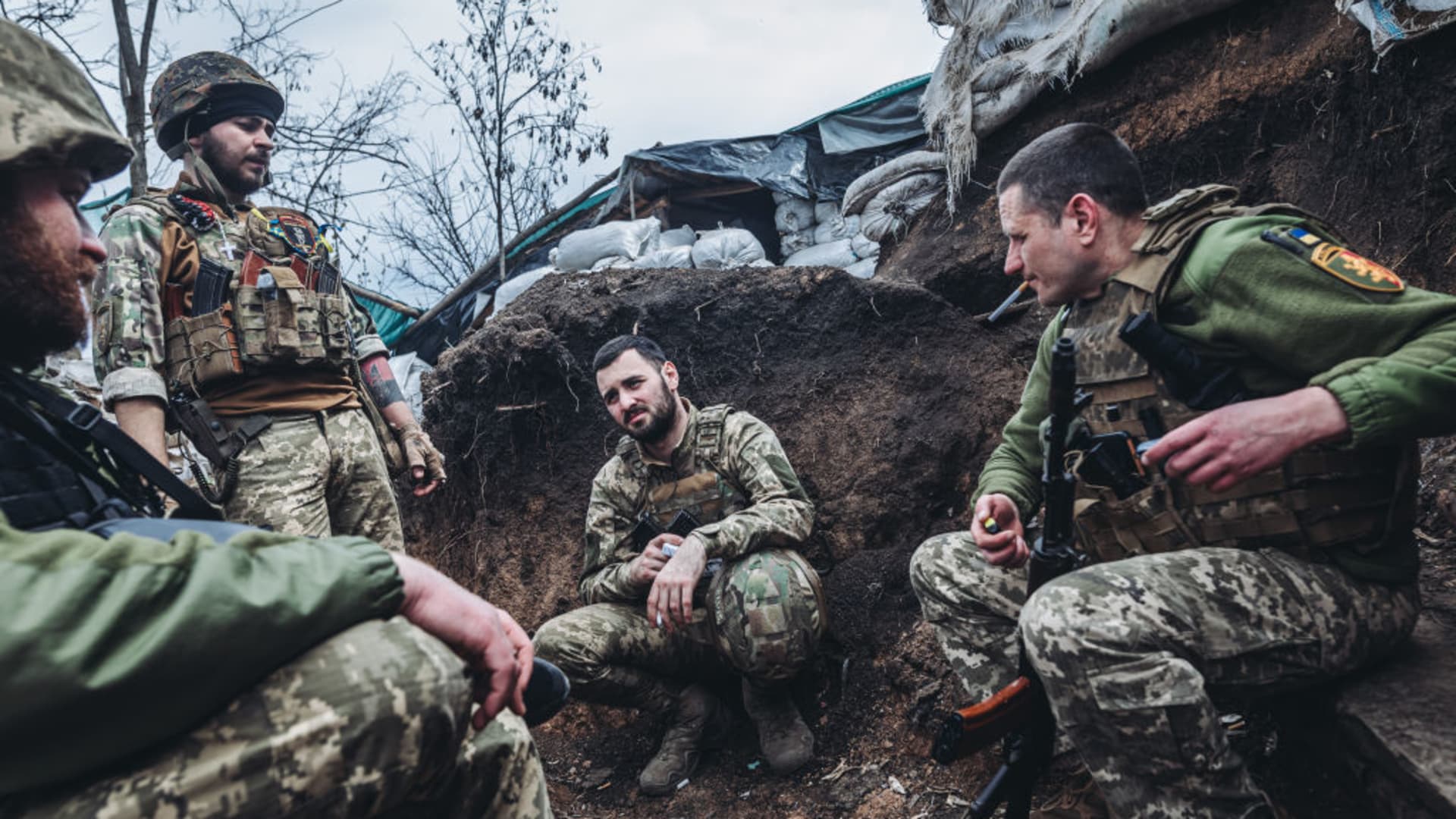 Ukrainian soldiers talk to each other at a Ukrainian frontline in Donbass, Ukraine on April 11, 2022.
