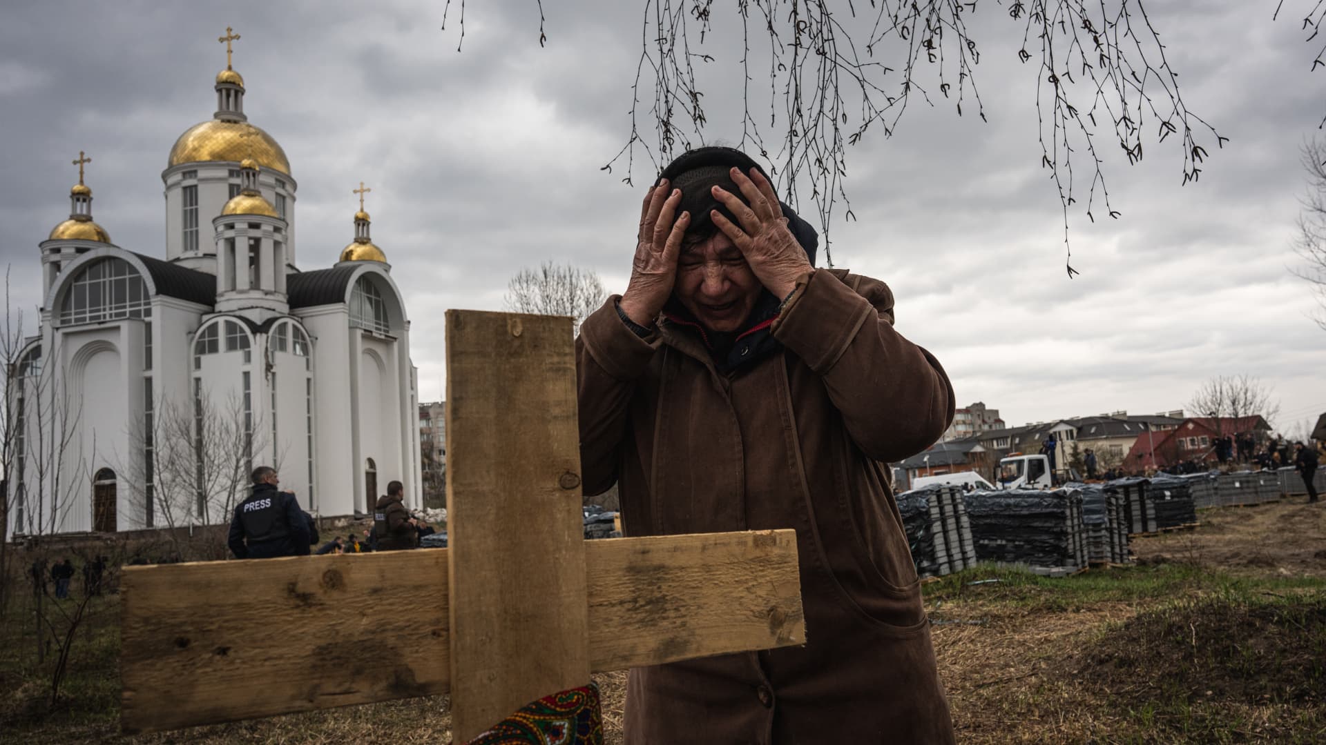 A woman mourns in Bucha, Ukraine, on April 8, 2022. The Office of the U.N. High Commissioner for Human Rights on Monday recorded 4,335 civilian deaths and injuries since Russia's invasion of Ukraine.