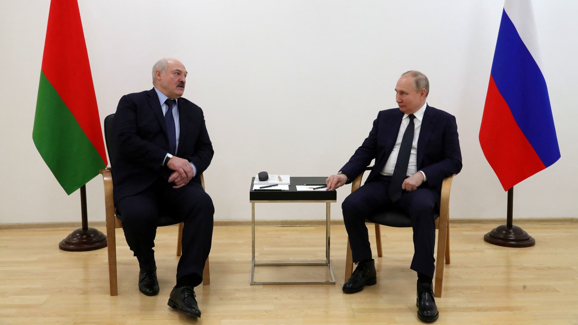 Russian President Vladimir Putin listens to Belarusian President Alexander Lukashenko during their meeting at the Vostochny Cosmodrome in Amur Region, Russia April 12, 2022. 