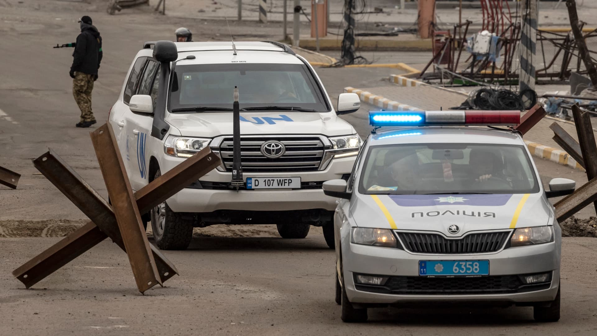 A UN and a police car seen in in Bucha, on the outskirts of Kyiv, on April 13, 2022, amid Russia's military invasion of Ukraine.